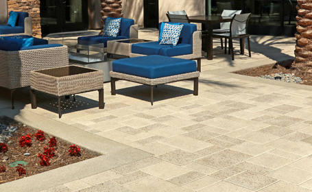 Granite Paver Backyard Patio with cushioned chairs and tables