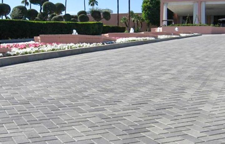 A long concrete paver on a public area